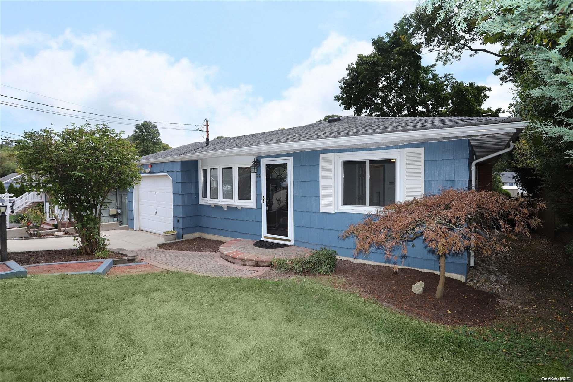 front view of a house with a yard