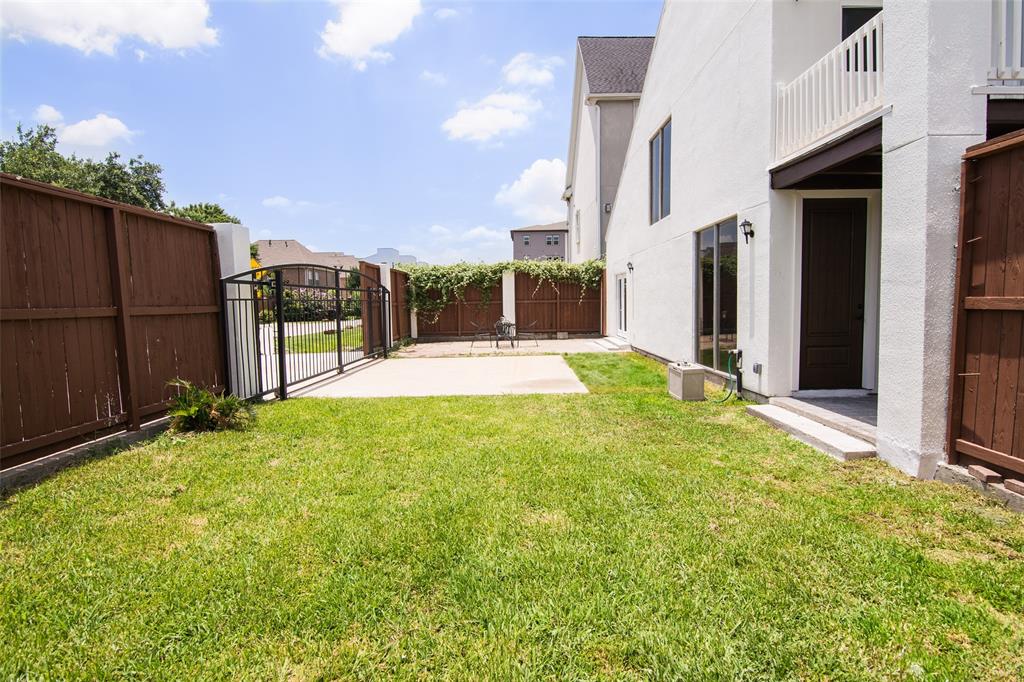 a swimming pool with outdoor seating and yard