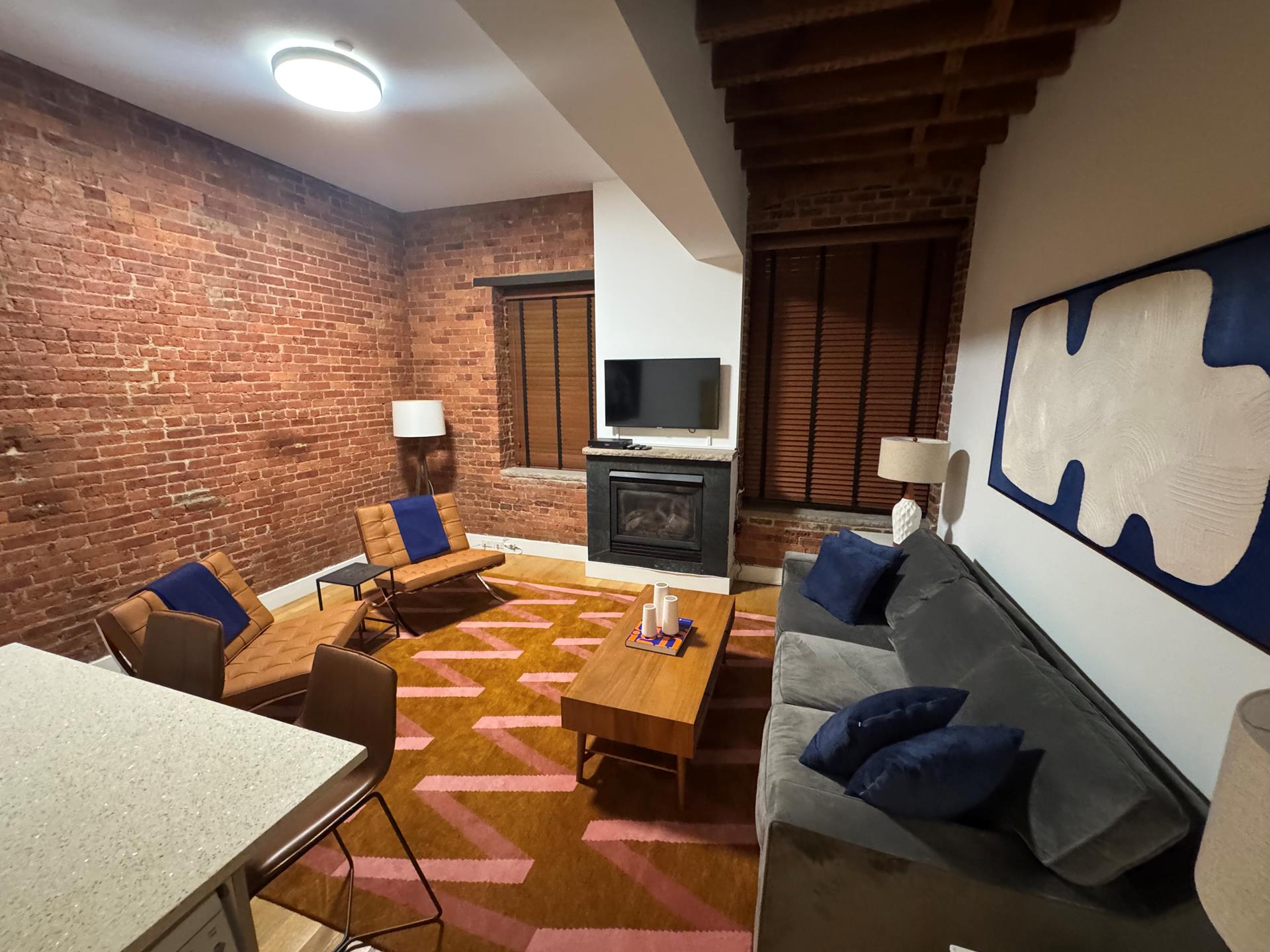 a living room with furniture and a flat screen tv