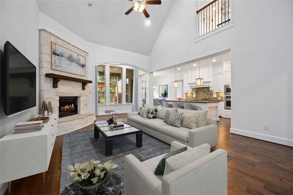 a living room with furniture fireplace and flat screen tv