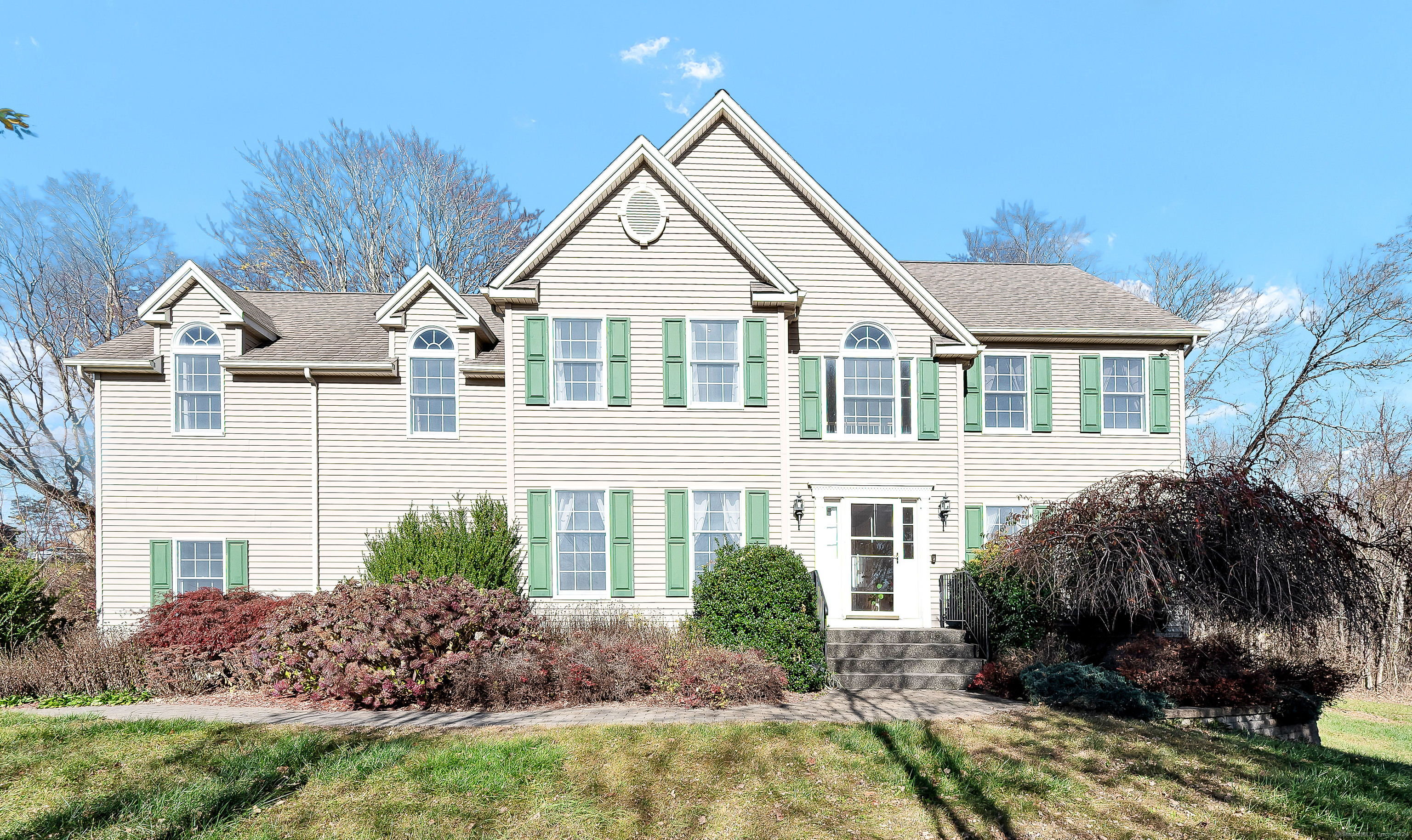 a front view of a house with a yard