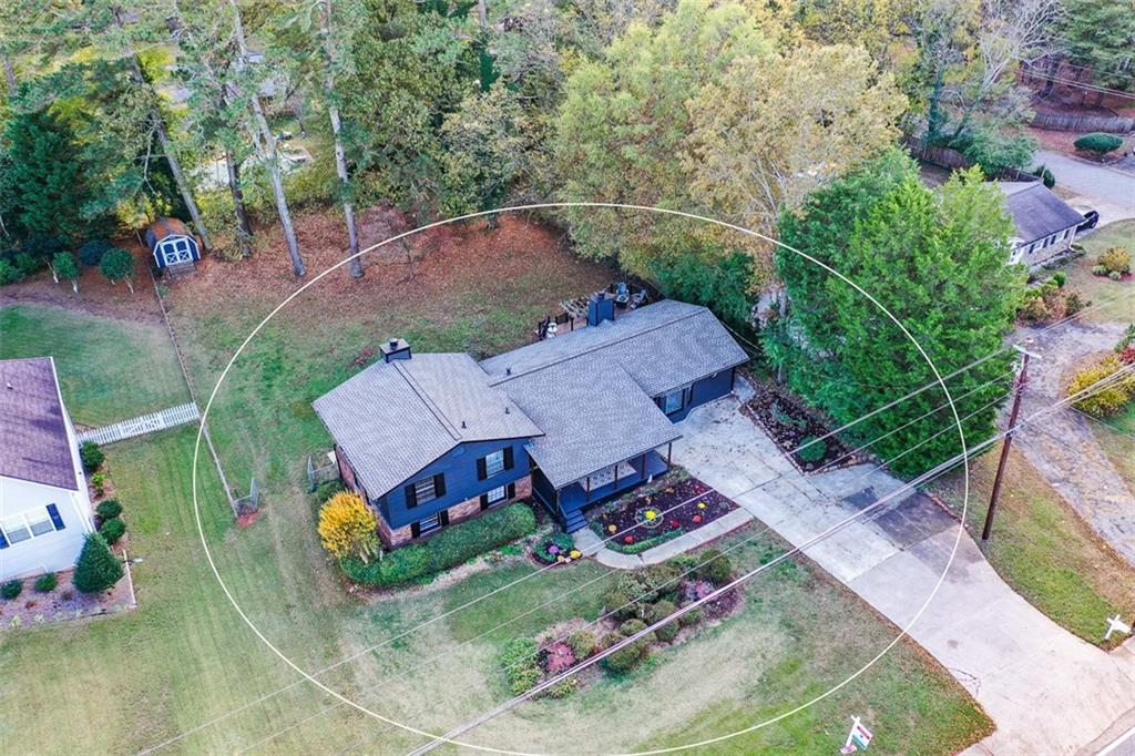 an aerial view of a house with an outdoor space