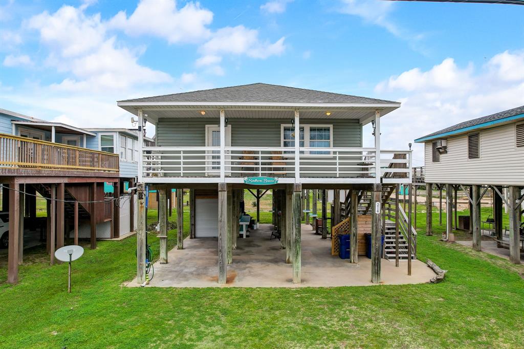 a front view of house with a garden and patio