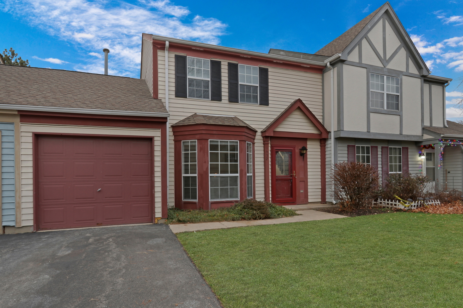 front view of a house with a yard