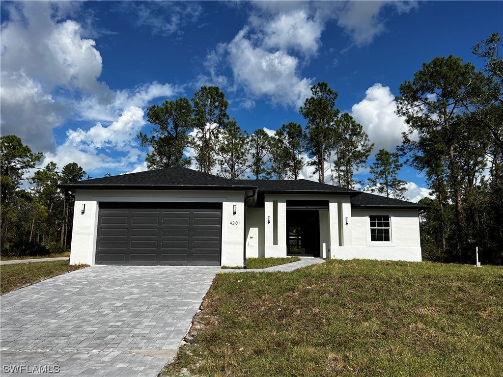 front view of a house with a yard