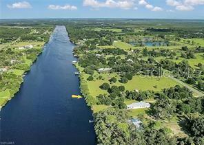 a view of a lake with a yard