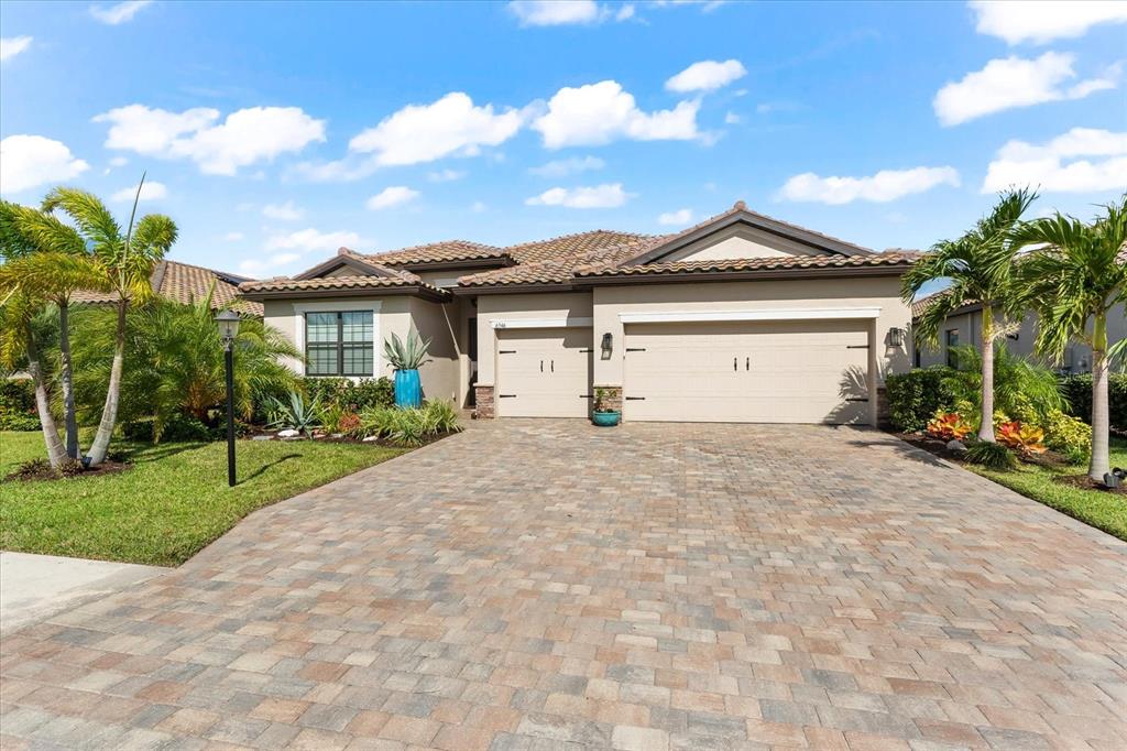 a view of house with outdoor space and garden