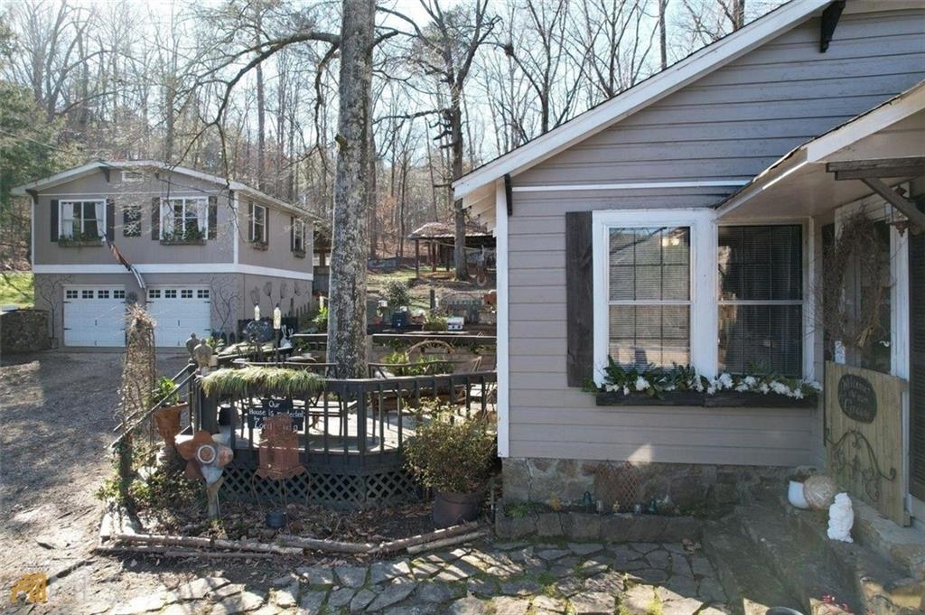 a front view of a house with outdoor seating