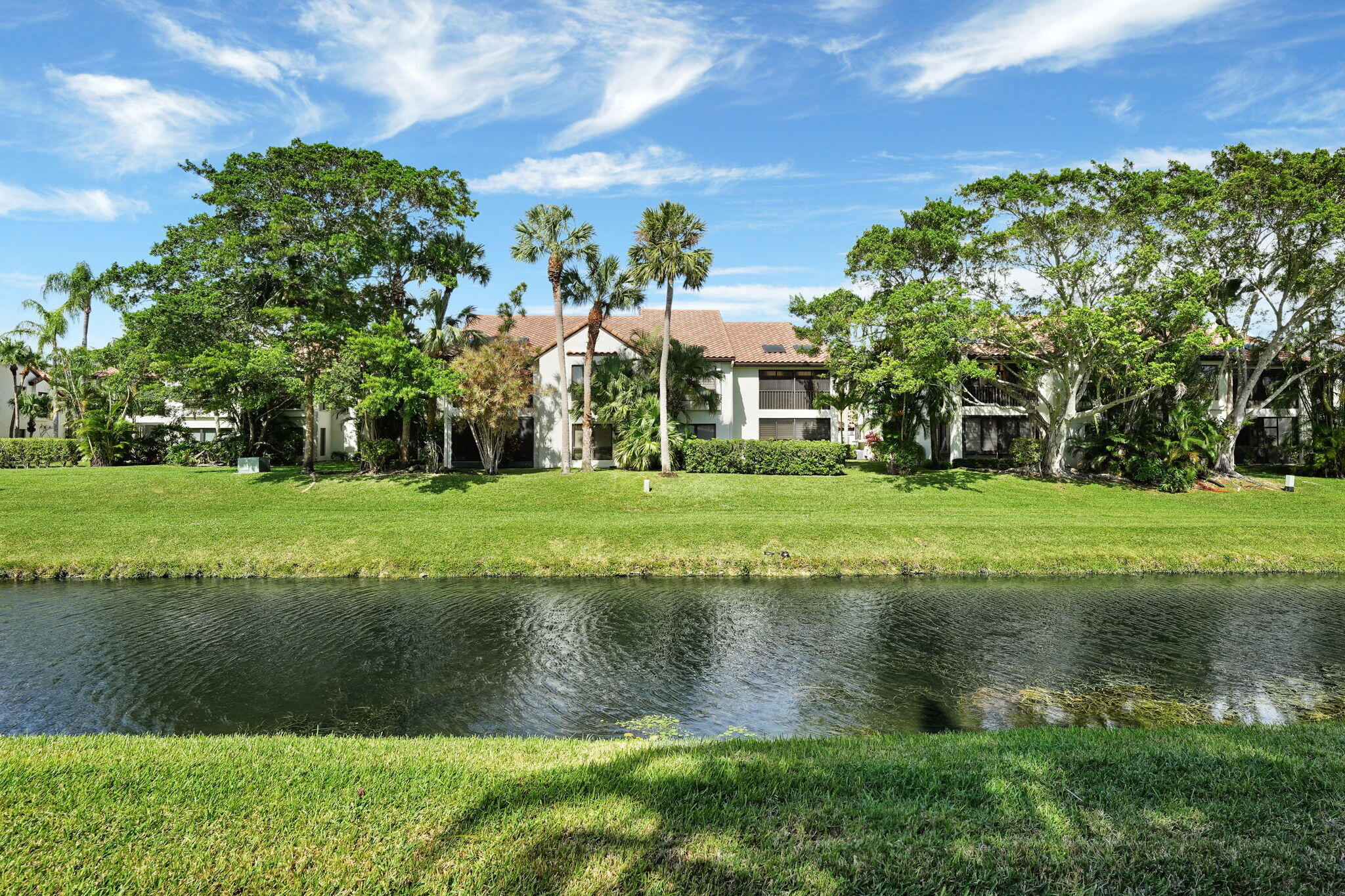 a view of a lake with a building in the background