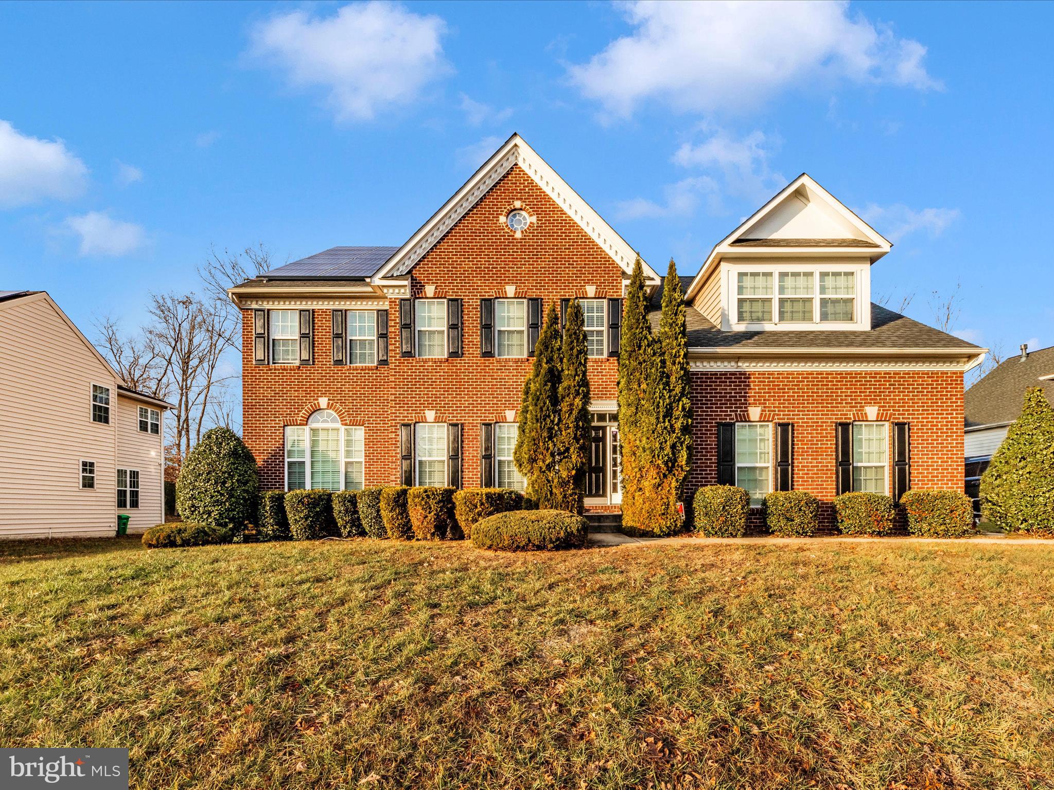 a front view of house with a yard