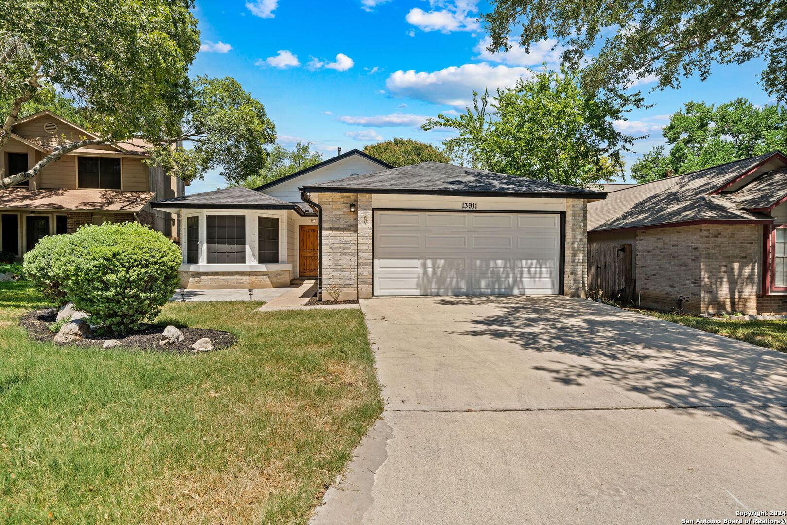 front view of a house with a yard