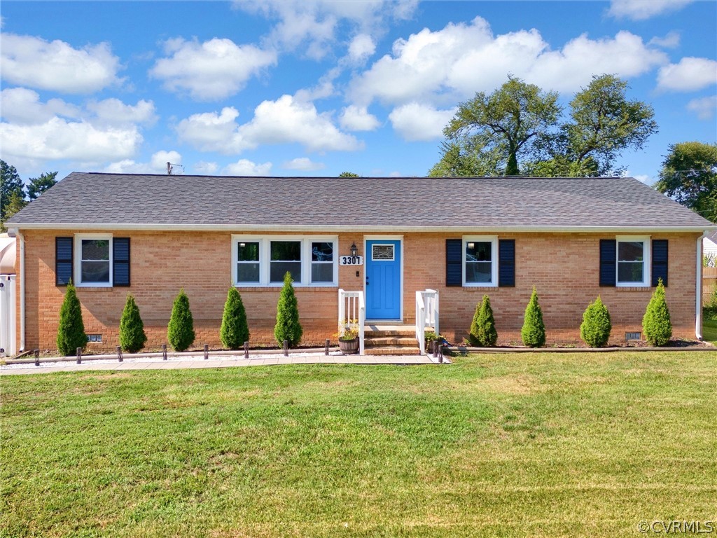 a front view of house with yard outdoor seating and green space