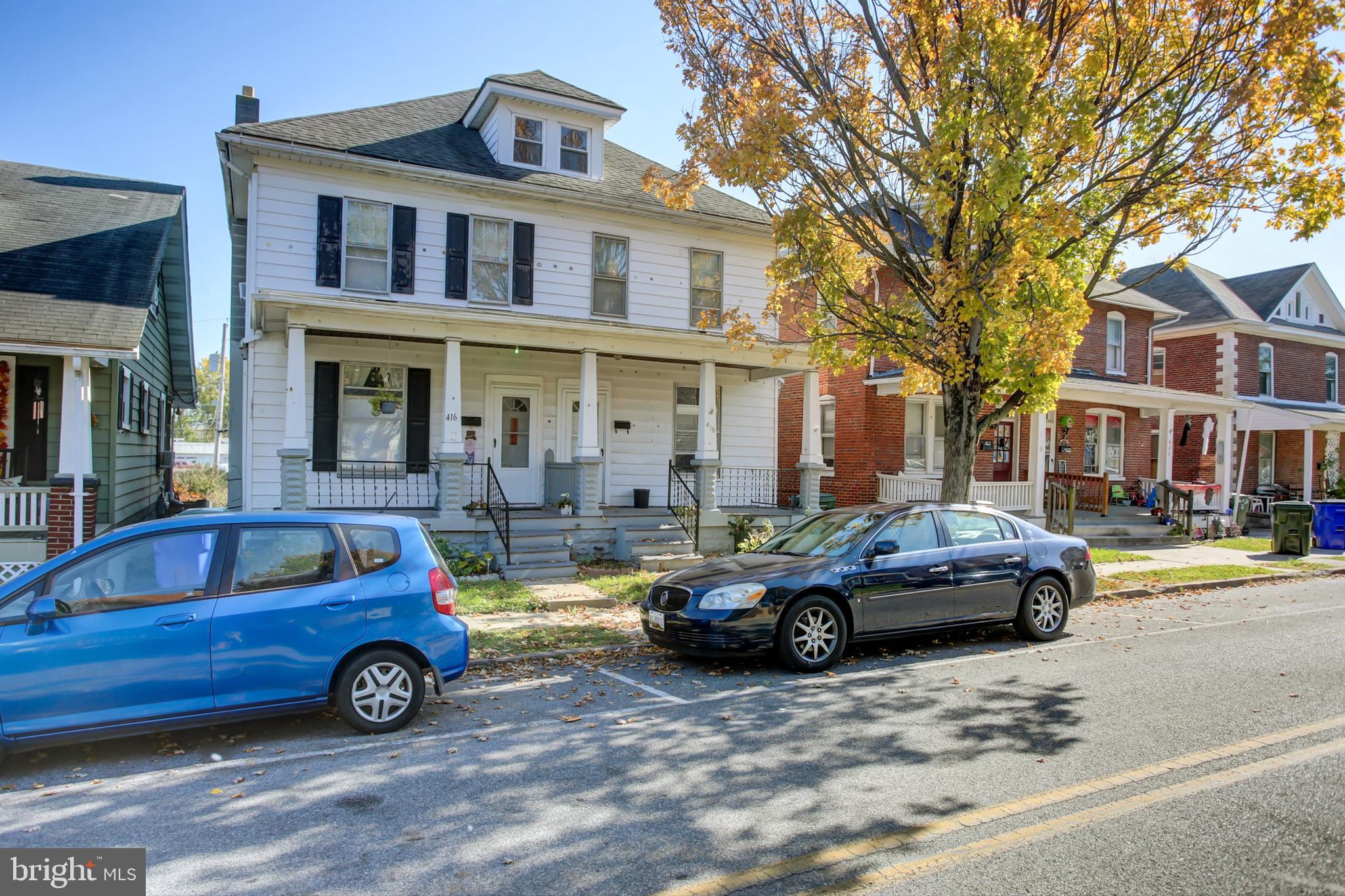 a car parked in front of a house