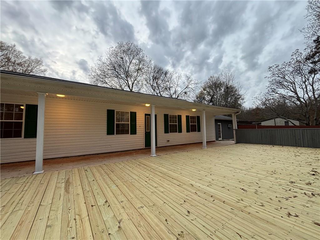 a backyard of a house with wooden floor