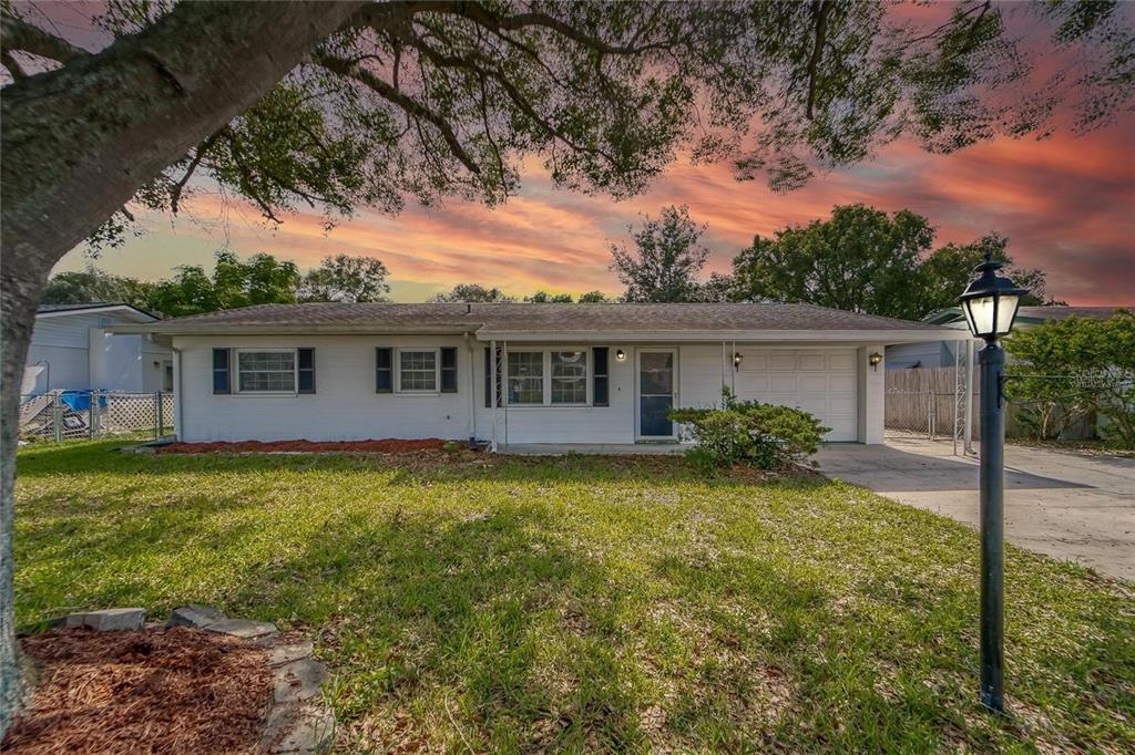 front view of a house with a yard