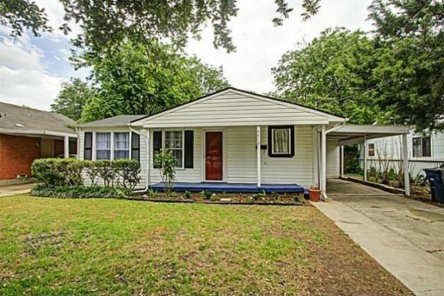 a front view of a house with yard porch and furniture