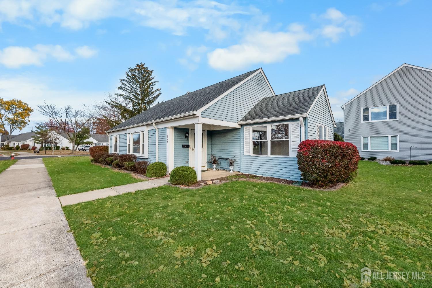 a front view of house with yard and green space