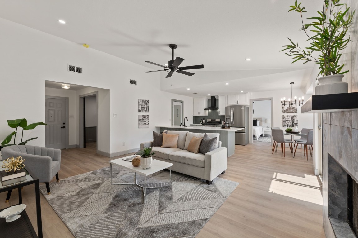 a living room with furniture and a fireplace