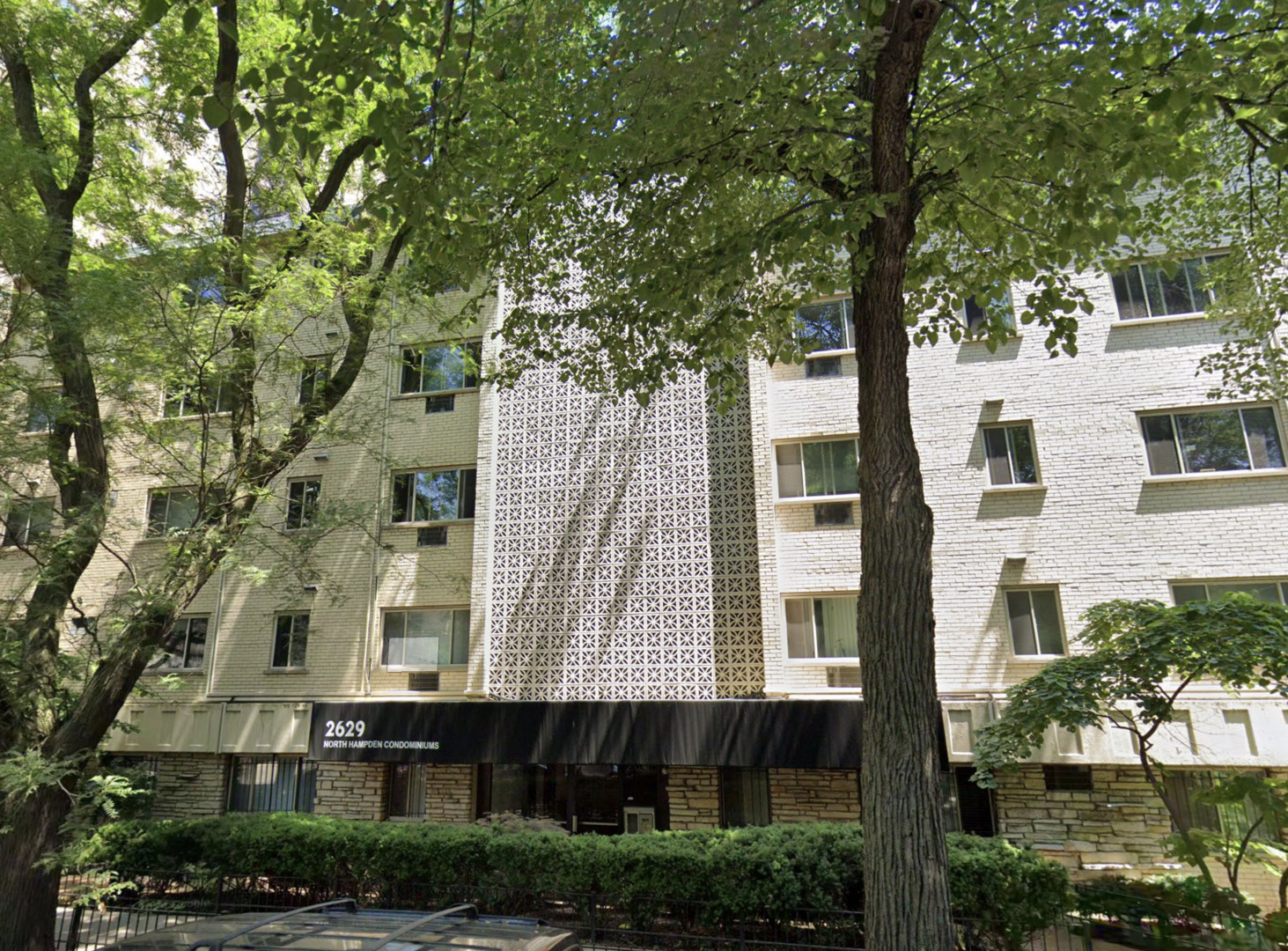 a large building with a tree in front of it