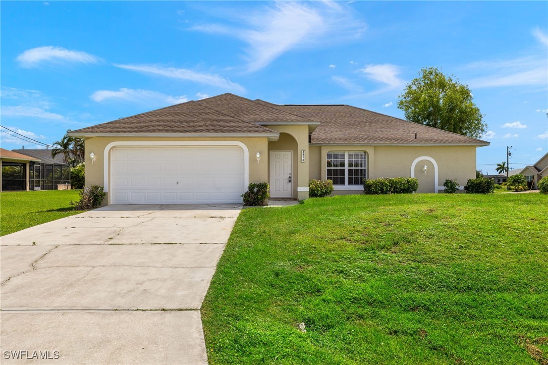 a front view of house with yard and green space