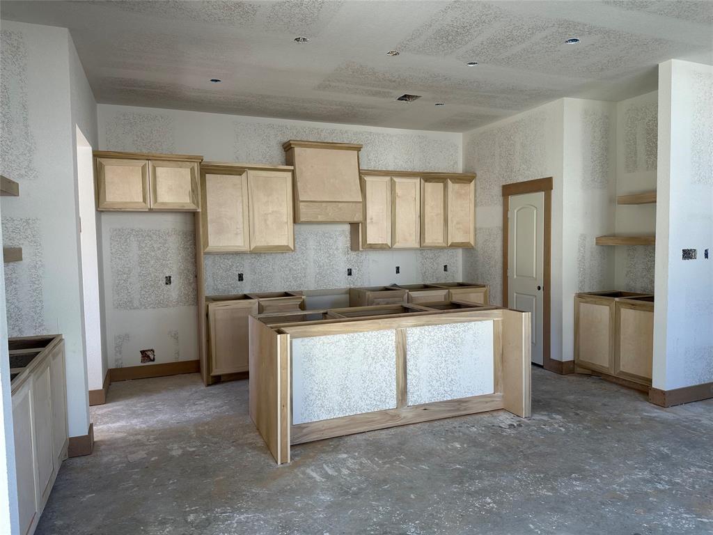 Your Dream Home is on it's way! Custom carpentry in the kitchen! Fully equipped with a 7 foot island, custom venthood, beverage station and decorative exposed shelving.