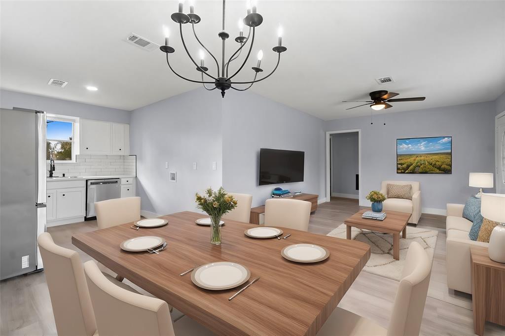 a view of a dining room with furniture and a table