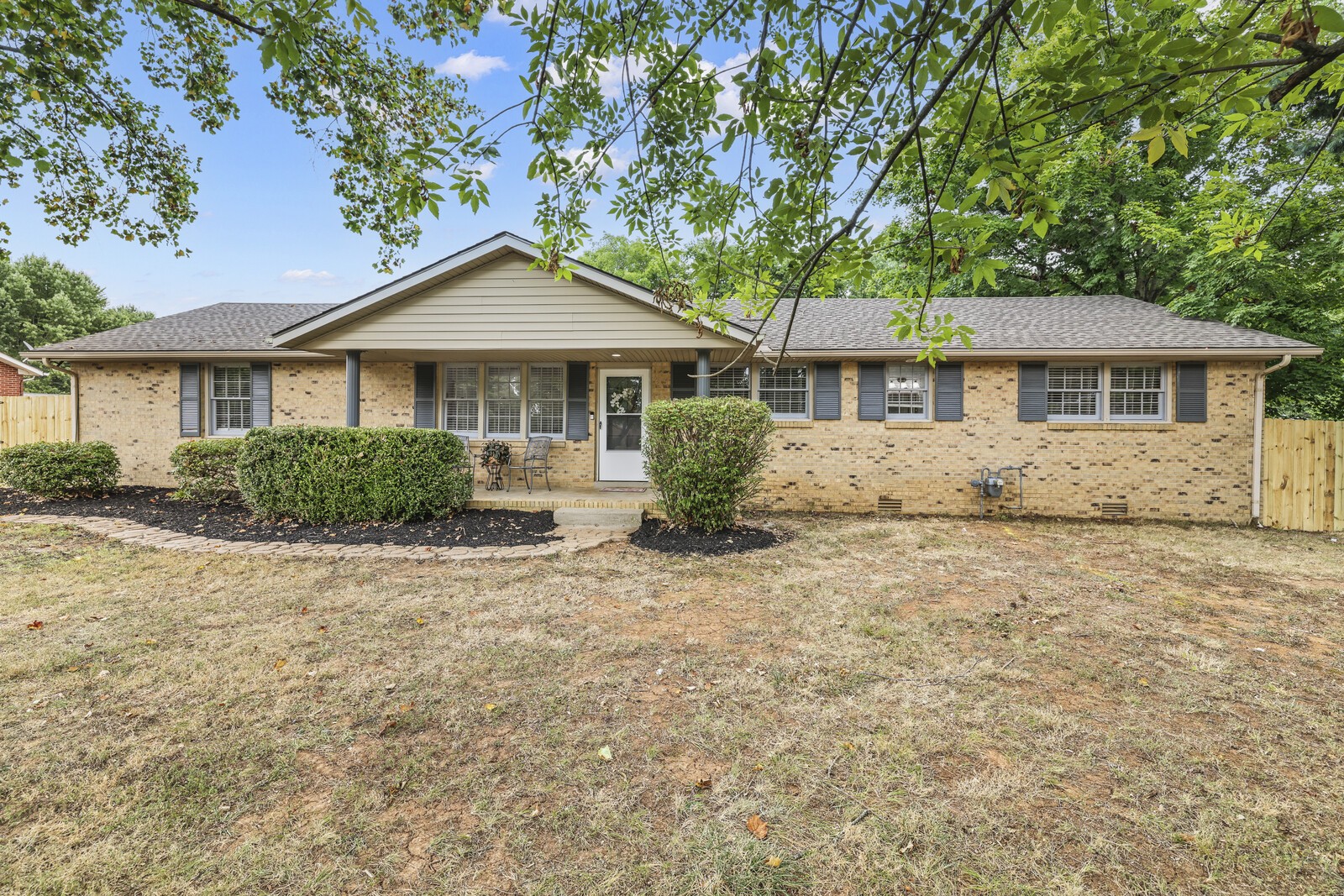 front view of a house with a yard