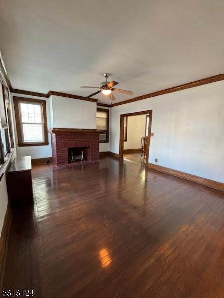 a view of a livingroom with furniture and a fireplace