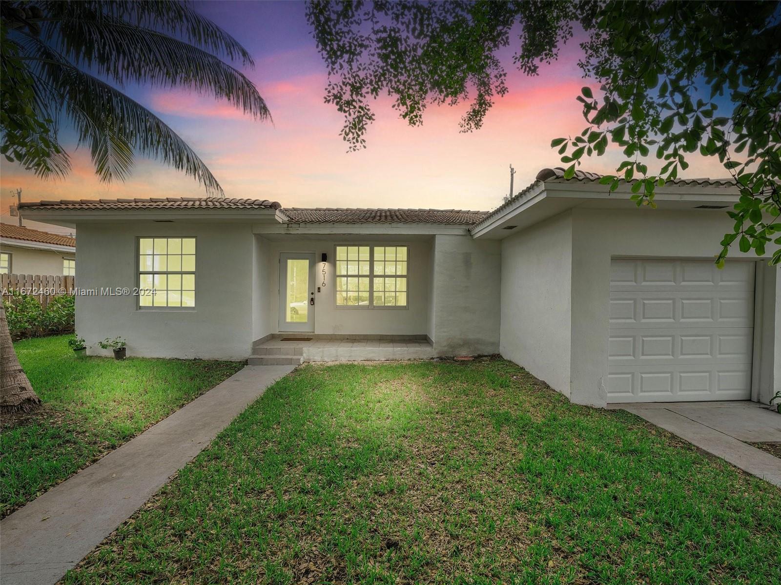 front view of a house with a yard