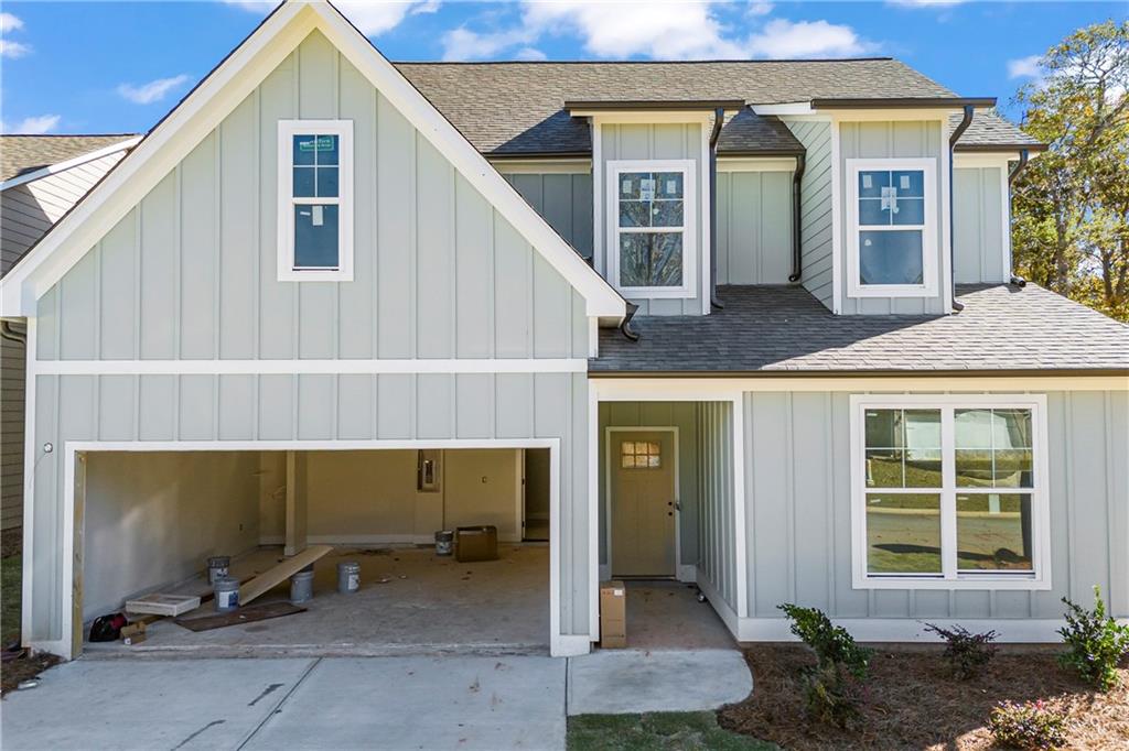 a view of front door and small yard