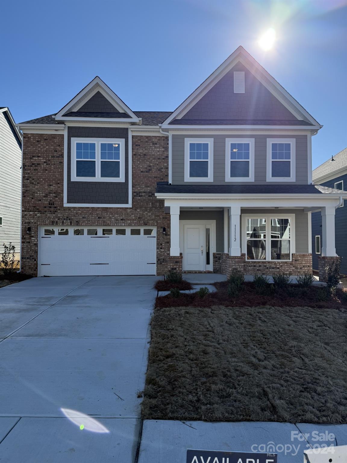 a front view of a house with yard