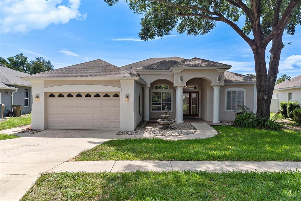 a front view of a house with a yard