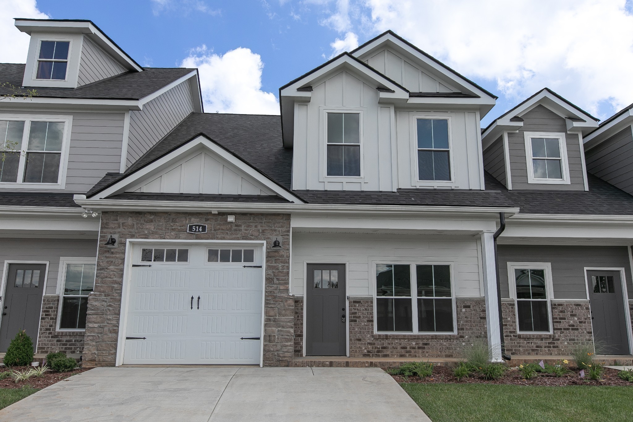 front view of a house with a yard