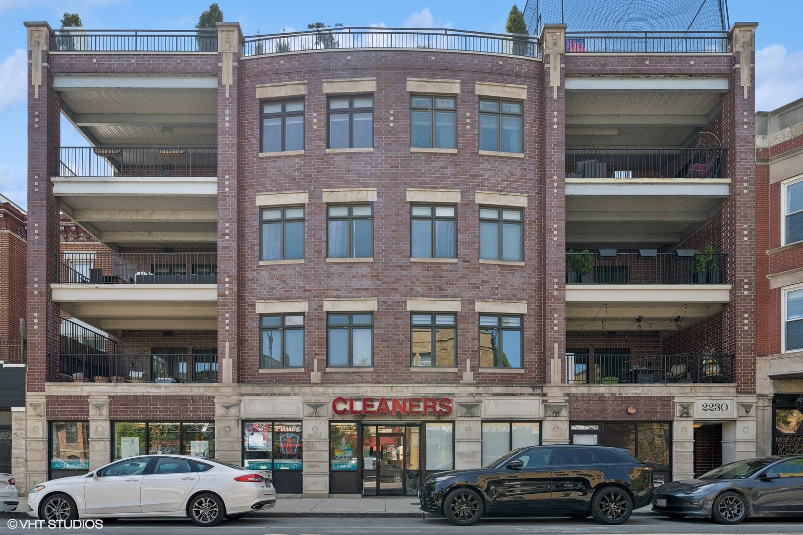 a front view of a building with parking space