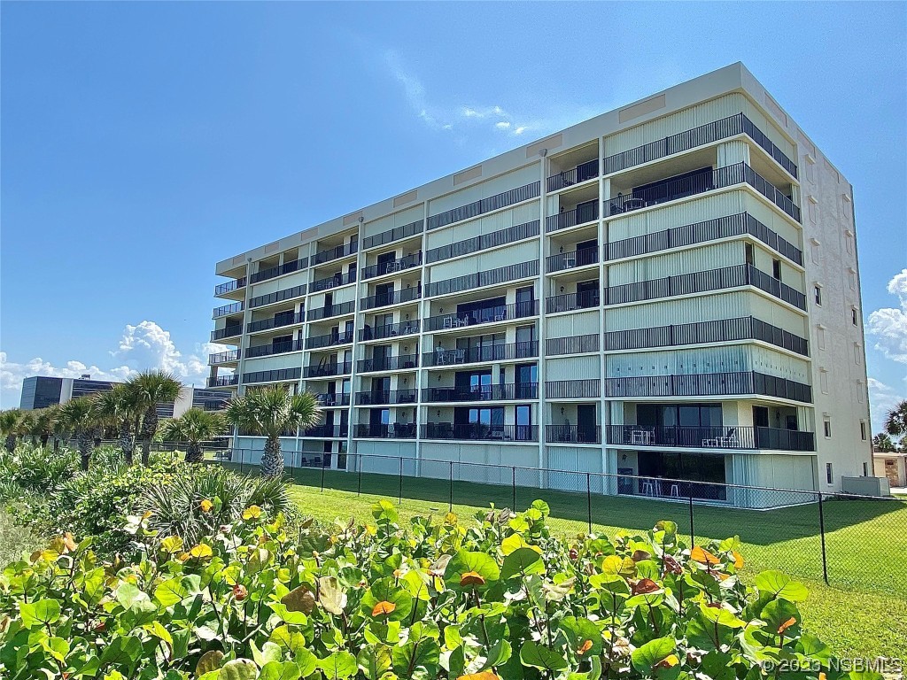 a view of building with yard