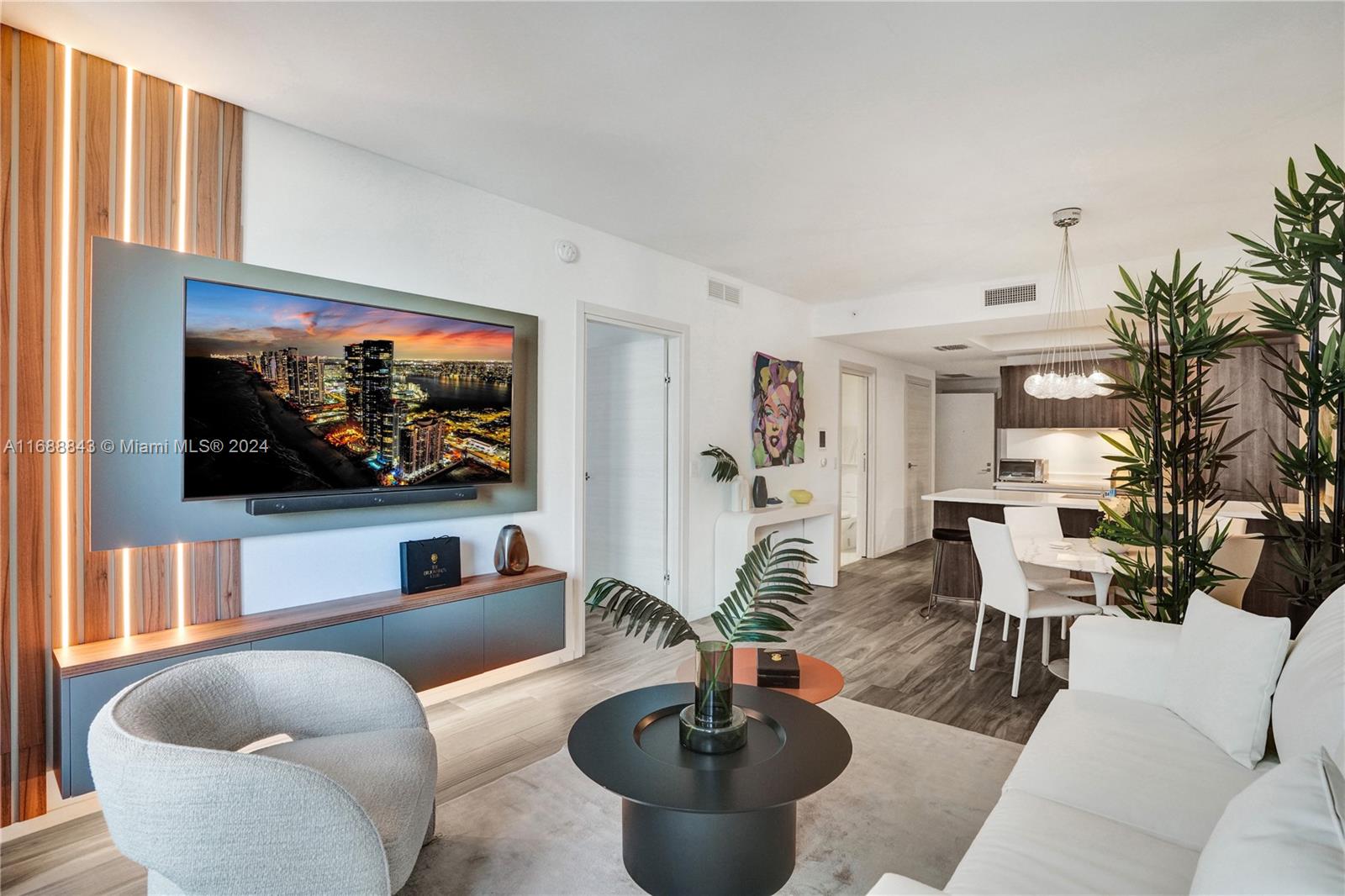 a living room with furniture and a flat screen tv