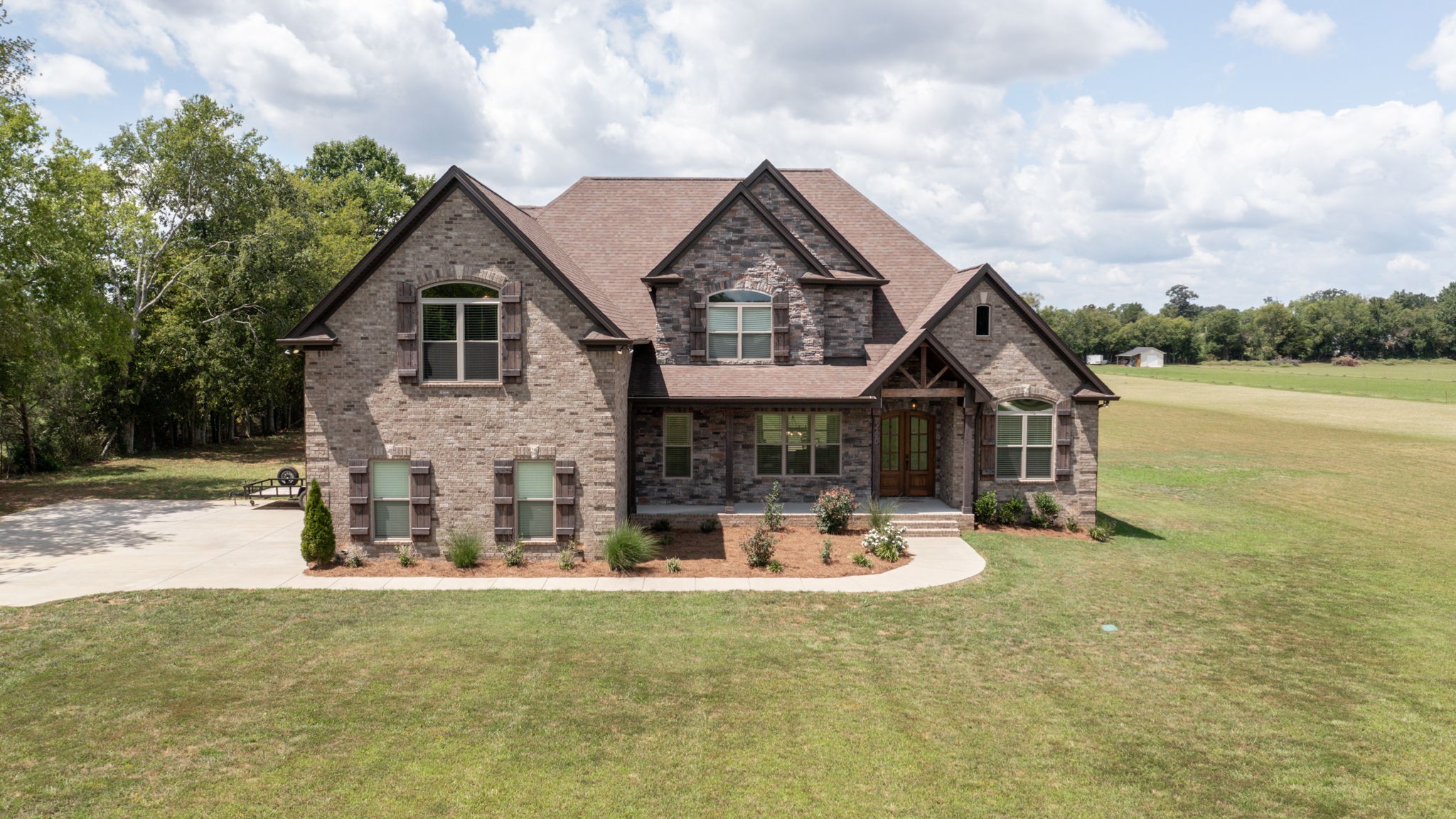 a front view of a house with a yard