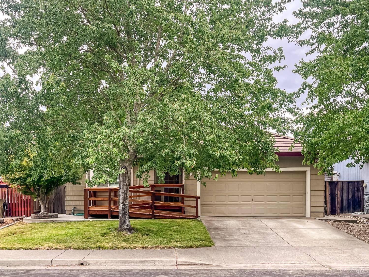 a view of a house with a tree