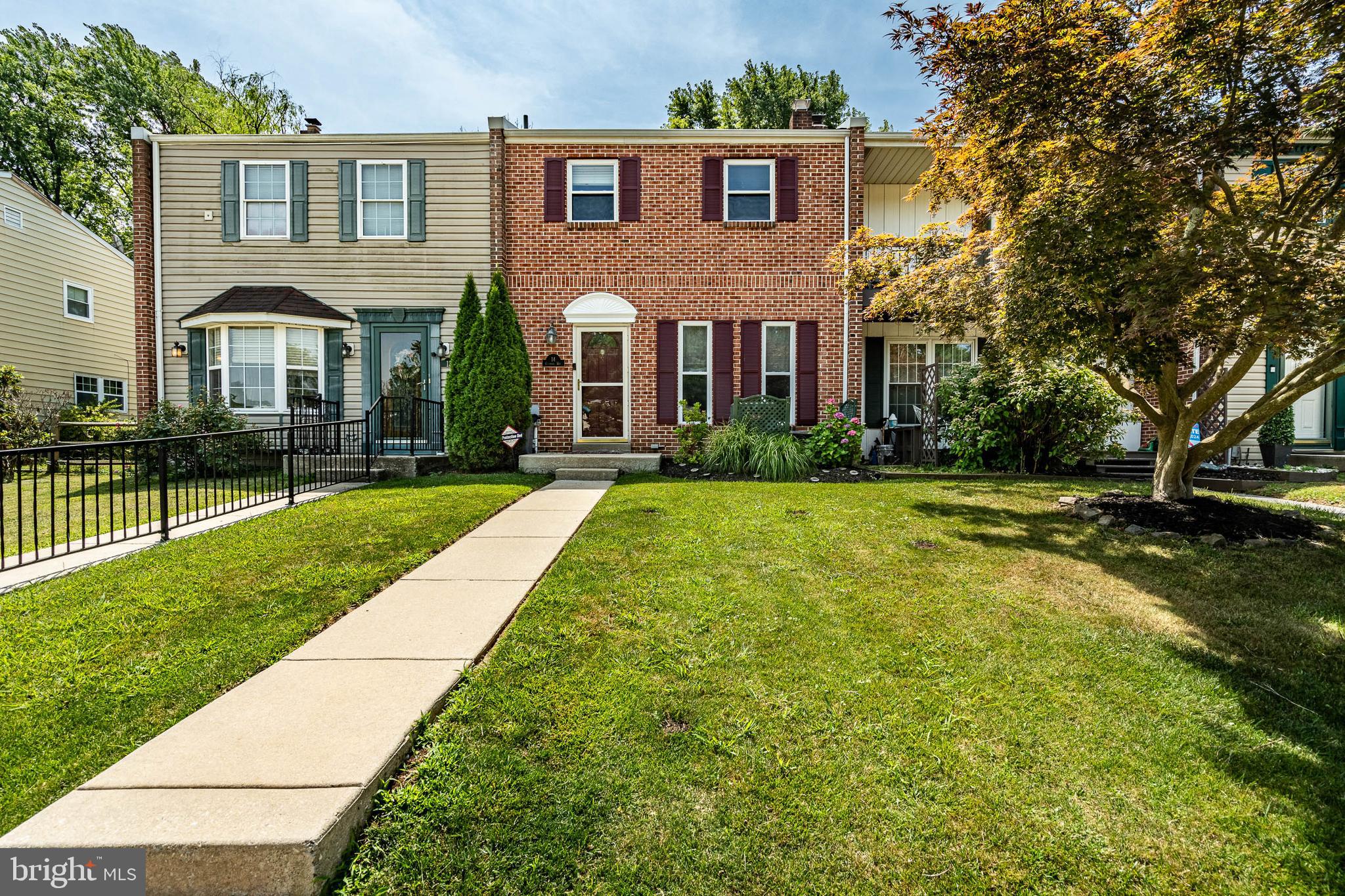 a view of house with yard