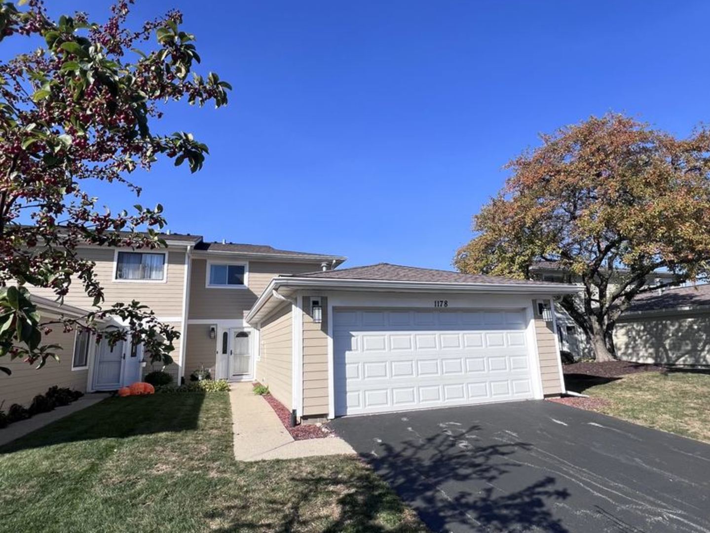 a front view of a house with a yard