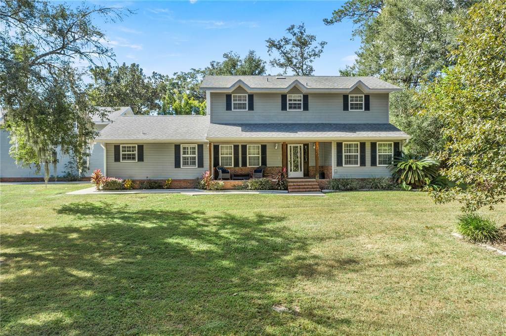 front view of a house with a yard