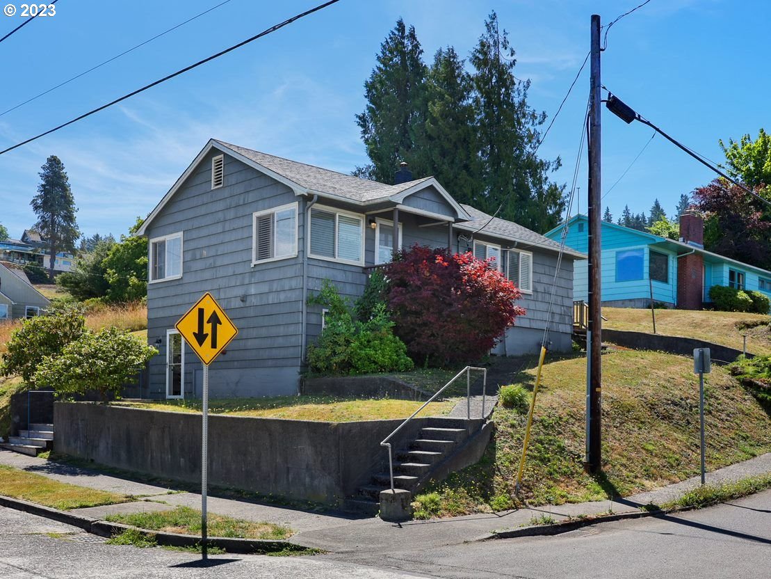 a front view of a house with parking