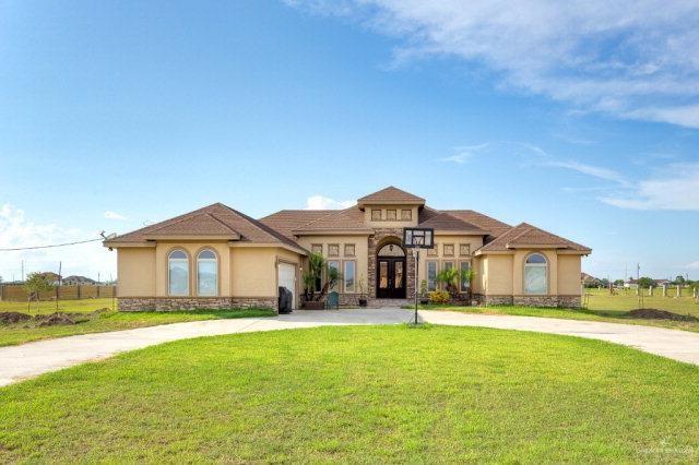 Mediterranean / spanish-style home featuring a front yard