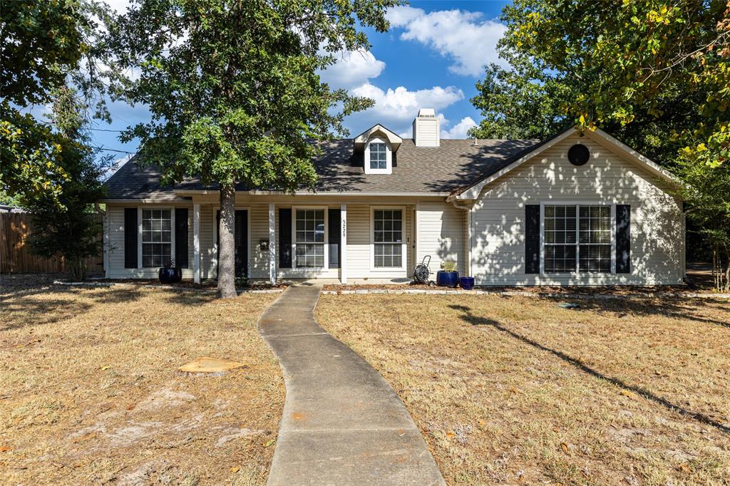 a front view of a house with a yard and porch