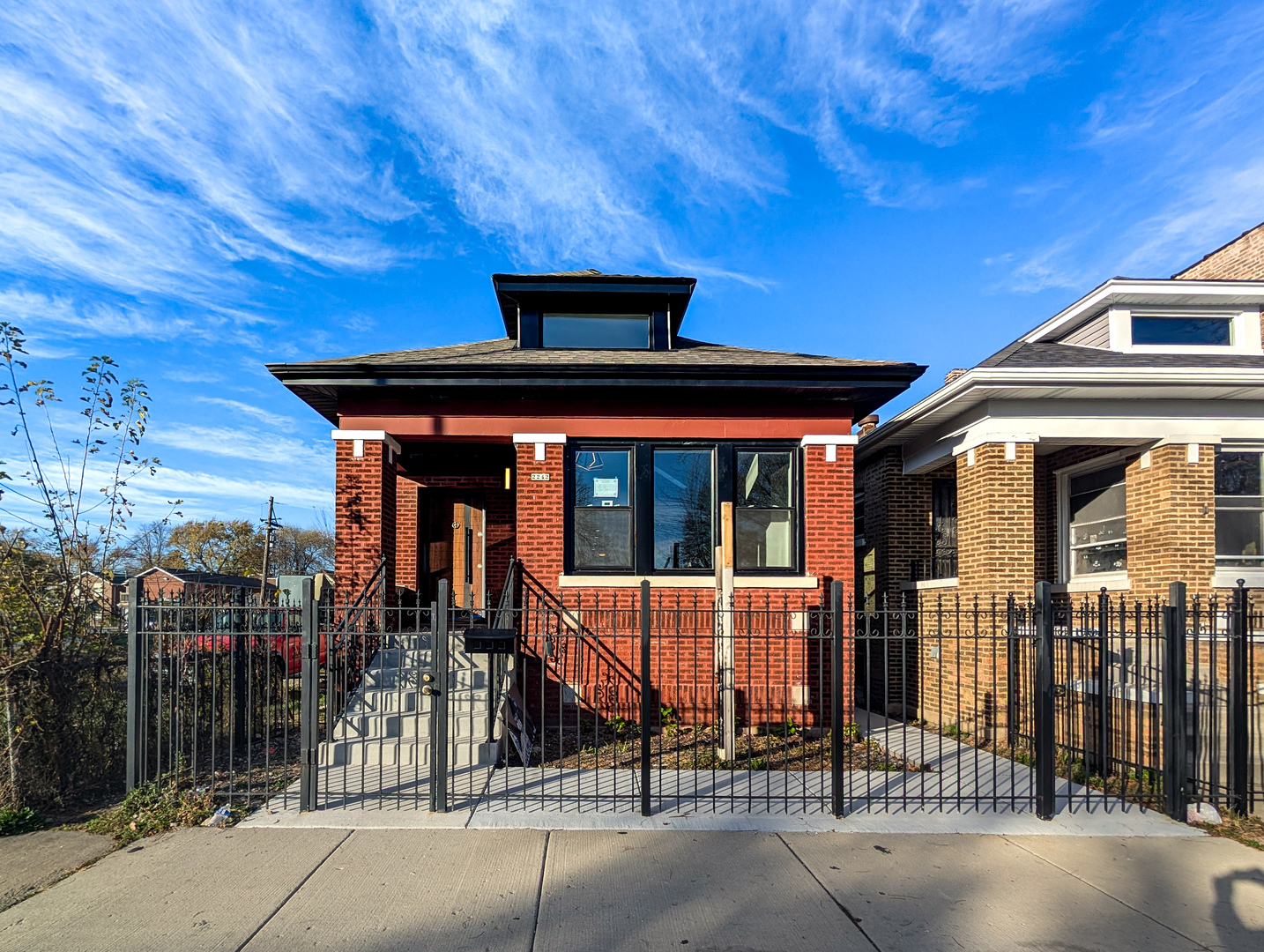 a front view of a house with glass windows