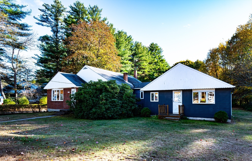 a front view of a house with yard