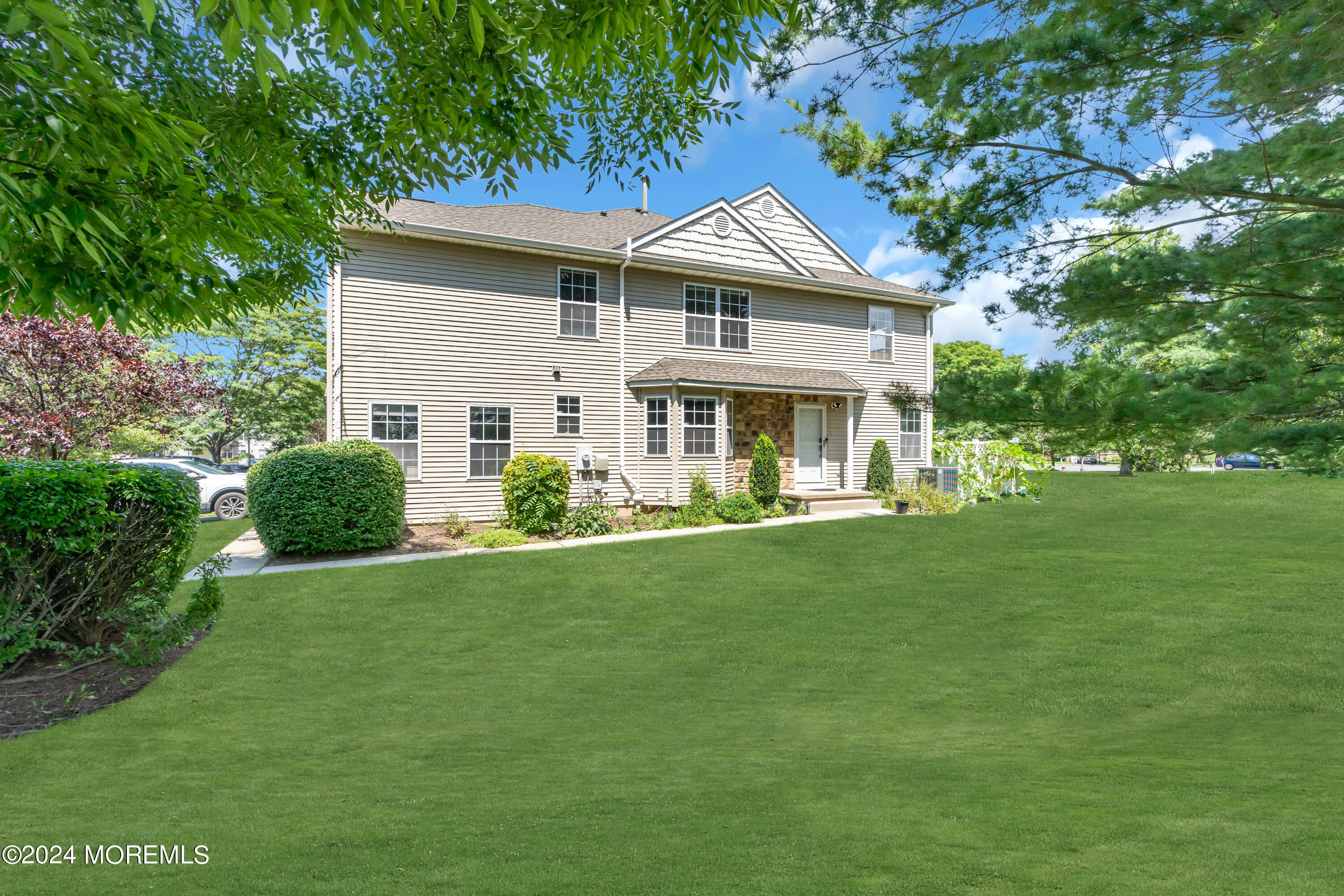 a front view of a house with a yard