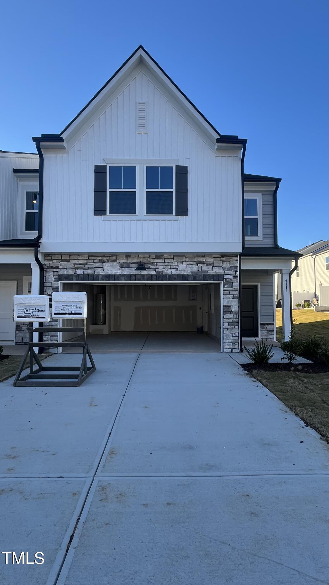 a front view of a house with garage