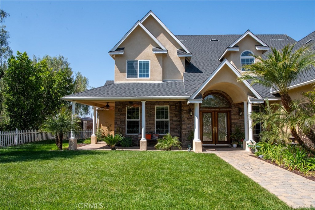 front view of a house with a yard