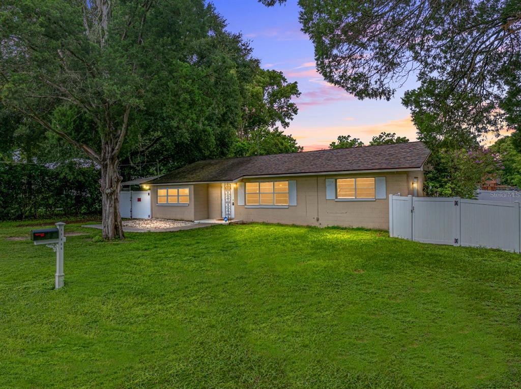 a view of a house with a yard